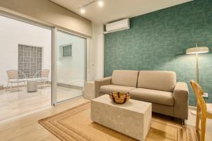 a living room with a couch and a table at MOON Apartments in Seville