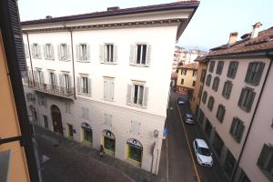 a view from a window of a street with buildings at Casa Angela Apartments in Bergamo