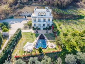 an aerial view of a house with a swimming pool at Vila Dy Bukurite Durres in Draç