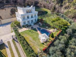 an aerial view of a large white house on a hill at Vila Dy Bukurite Durres in Draç