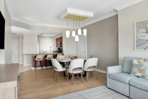 a kitchen and dining room with a table and chairs at Marriott BeachPlace Towers 1BD in Fort Lauderdale