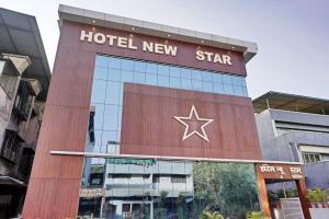a hotel new star sign on the side of a building at Hotel New Star in Navi Mumbai