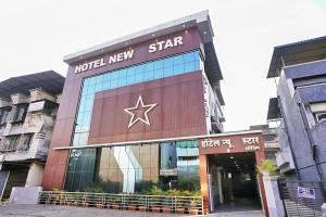 a building with a new star sign on it at Hotel New Star in Navi Mumbai