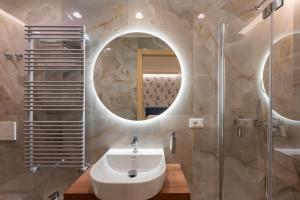 a bathroom with a sink and a mirror at 5 Terre Lodge in La Spezia +59 photos