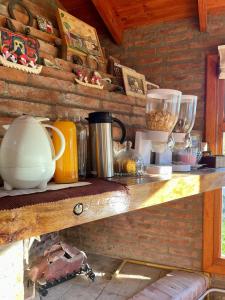 a wooden shelf with various items on it at Hosteria Miyazato Inn in El Calafate +8 photos