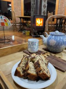 a slice of bread on a plate on a table at Hosteria Miyazato Inn in El Calafate