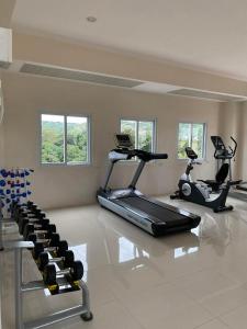a gym with several exercise bikes in a room at Thyme Residence The VAs Nest Near Anjo World Free Pool and Gym in Minglanilla