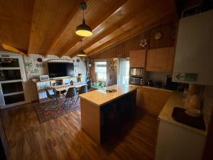 an overhead view of a kitchen with a table and chairs at Hostal Senderos del Sur in Freire