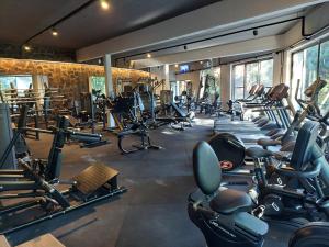 a gym with a bunch of treadmills and machines at Raices Amambai Lodges in Puerto Iguazú