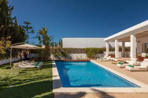a swimming pool in the backyard of a house at New! Villa Lina in Santa Gertrudis de Fruitera