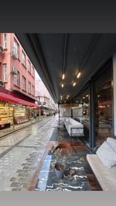 a building with a street with dogs laying on the ground at the Amara Hotel in Istanbul