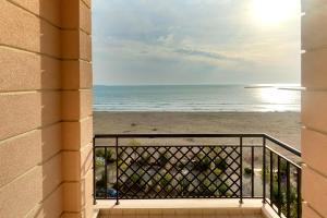 a view of the beach from a balcony at Hotel Brilant in Shëngjin