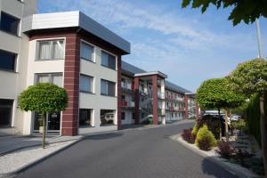 an empty street in front of a building at Hotel Soray in Wieliczka