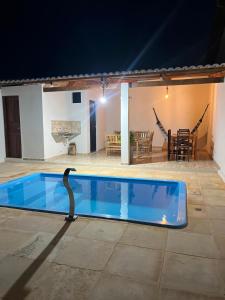 a swimming pool with a swan in a house at Casa Tito in Cascavel