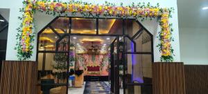 an entrance to a church with a floral arch at Ruchi resort in Hisār