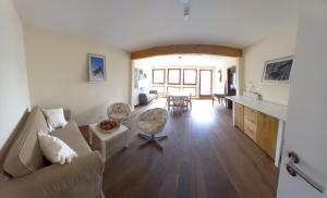 a living room with a couch and a table at Weingut Harald Konrad Fehres in Brauneberg