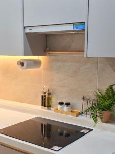a kitchen counter with two bottles on a shelf at Stay Noop in Gyeongju +25 photos