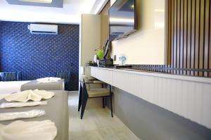 a hotel room with a sink and a mirror at the Amara Hotel in Istanbul +88 photos