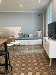 a living room with a couch and a tv at La dolce vita in Intra +9 photos