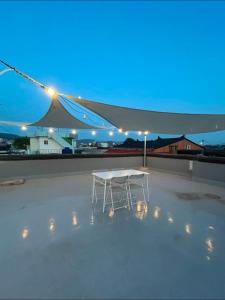 a white table sitting on top of a roof at Stay Noop in Gyeongju