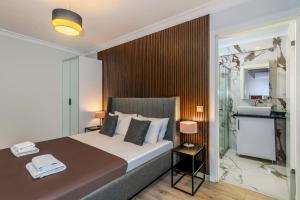 a bedroom with a large bed and a bathroom at Etiz Hotels & Residences in Istanbul