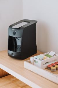 a black printer sitting on top of a table at Cavae - Le stanze in Massafra