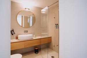 a bathroom with a sink and a mirror at Cavae - Le stanze in Massafra +44 photos
