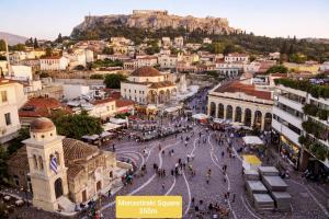 an aerial view of a city with the acropolis at Psirri Lofts in Athens