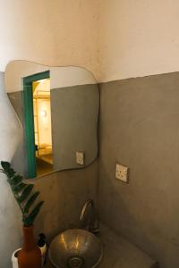 a bathroom with a sink and a mirror at Fins Arugambay in Arugam Bay +42 photos