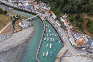 an aerial view of a harbor with boats in the water at Watersmeet Terrace in Lynmouth +3 photos