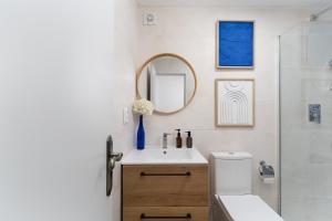 a bathroom with a sink and a mirror at Casa Margot Old Town Rooftop Walk Promenade in Portimão +20 photos