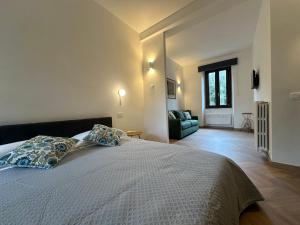 a bedroom with a bed with two pillows on it at Piazza Sant'Agostino Rooms in Bagnoregio