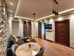 a living room with a couch and a table at Meteora Gaia in Kastraki