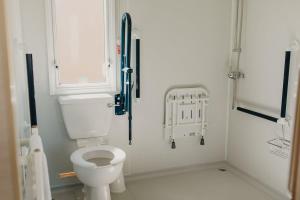 a small bathroom with a toilet and a window at Upper Cliff 4 in Easton +6 photos