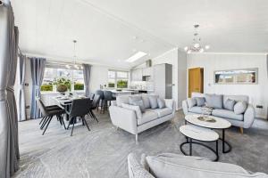 a living room with couches and a dining room at Host & Stay - Marble Lodge in Beverley