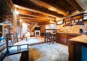 a large room with a kitchen and a dining room at Albert Authentic Suites Brasov - Tampa View - Preferred Spa Rates & Exclusive Guest Benefits in Braşov