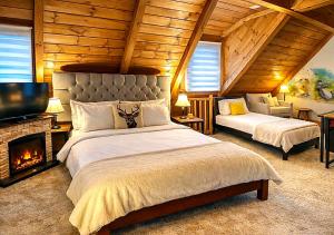 a bedroom with a large bed and a fireplace at Albert Authentic Suites Brasov - Tampa View - Preferred Spa Rates & Exclusive Guest Benefits in Braşov
