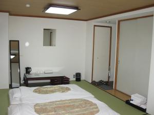 Postel nebo postele na pokoji v ubytování Hotel Tsukuba Hills Umezono