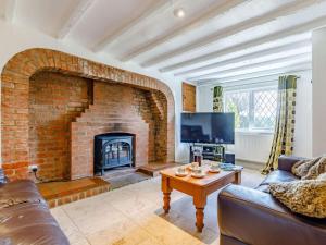 a living room with a large brick fireplace at 2 Bed in Ashbourne oc-82579 in Longford