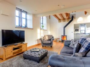 a living room with a large flat screen tv at 3 Bed in Buxton oc-52891 in Sheen