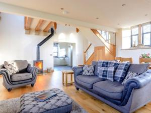 a living room with two couches and a fireplace at 3 Bed in Buxton oc-52891 in Sheen