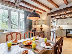 a kitchen and dining room with a table with food at 2 Bed in Bakewell oc-61862 in Baslow