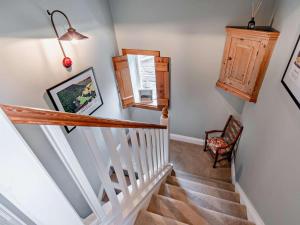 a staircase in a home with white walls and a stair case at 2 Bed in Bakewell oc-61862 in Baslow