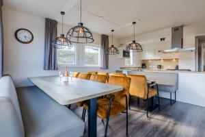 a kitchen and dining room with a table and chairs at Landal Winterberg in Winterberg