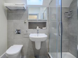 a bathroom with a sink and a toilet and a shower at 2 Bed in Chipping Campden oc-78128 in Chipping Campden +25 photos