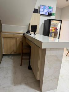 a reception desk in a store with a refrigerator at Hotel Marinho in Gurupi +23 photos