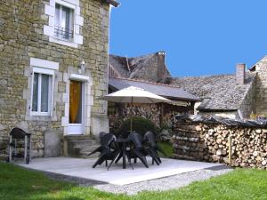 a group of chairs sitting in front of a building at Chez clÉmentine in Antheny