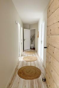 a hallway with a door and a wooden floor at Villa Tarabucetta by Interhome in Figari +23 photos