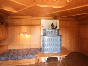 a room with a blue cabinet in the corner of a room at Chalet Schlitters by Interhome in Schlitters