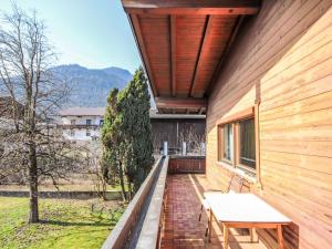 a porch of a house with a table on it at Chalet Schlitters by Interhome in Schlitters